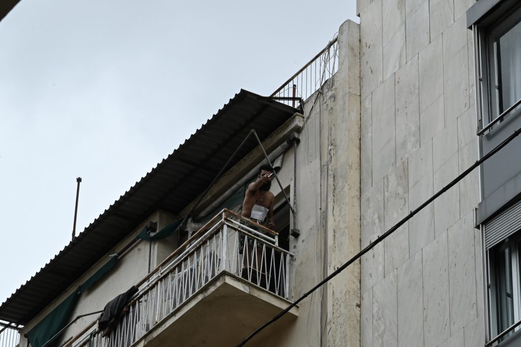 Man Threatening to Jump off 6th Floor in Athens