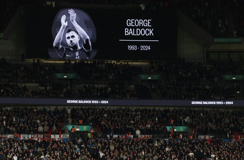 Mourners Pay Last Respects for George Baldock